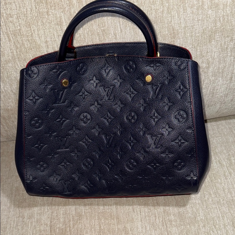 Louis Vuitton  Montaigne MM authentic deep blue red trim.